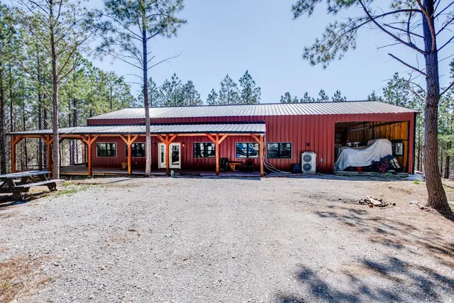 a front view of house with deck and outdoor seating