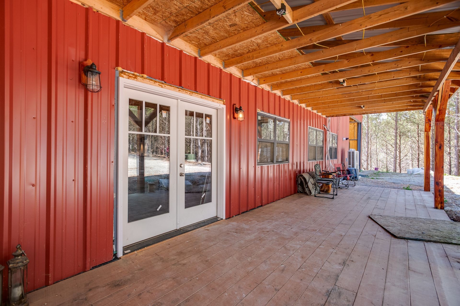 201 Summit Drive Linden, TN 37096 - Photo 3 of 31 a view of a porch with furniture and floor to ceiling window