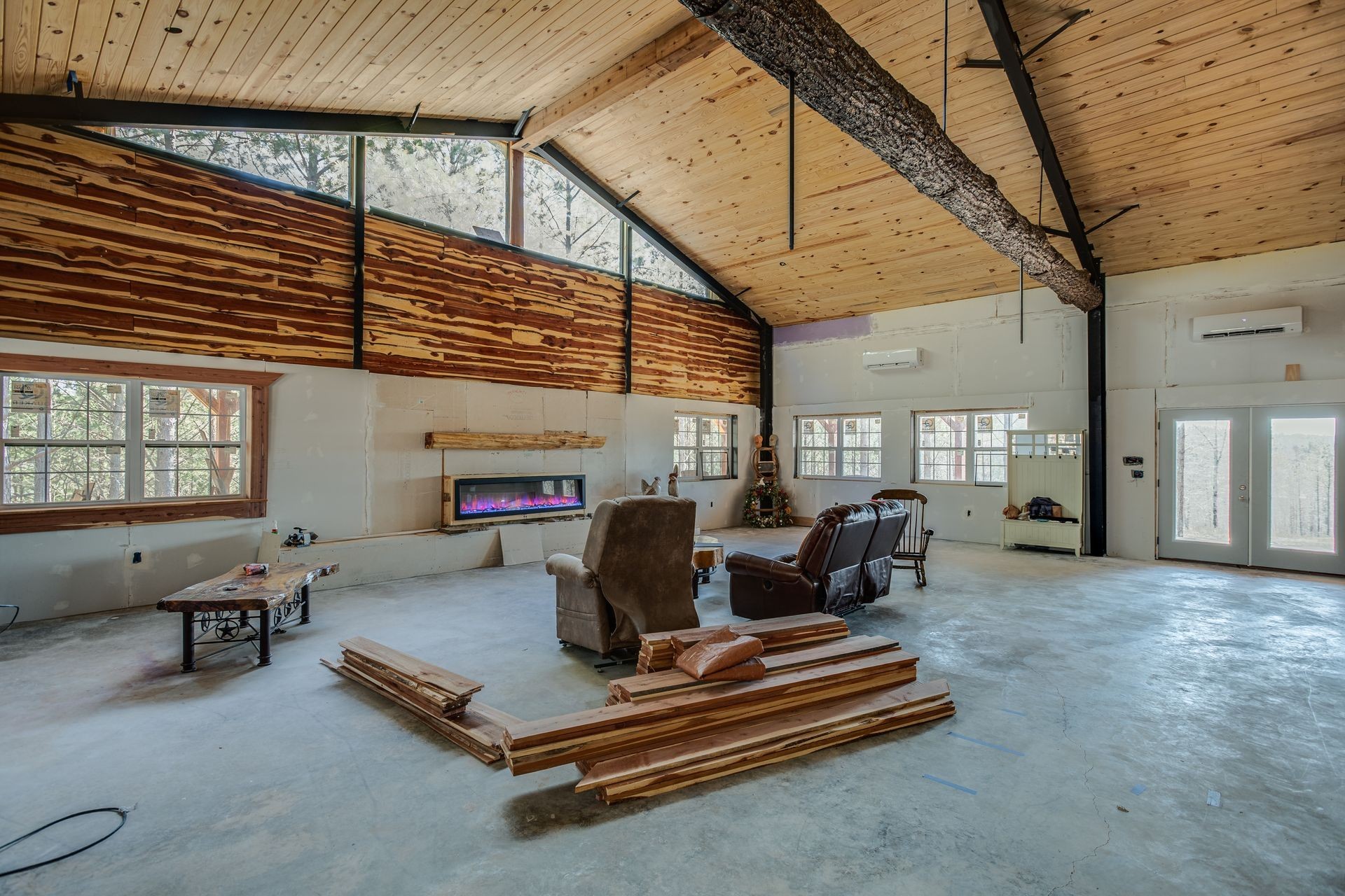 201 Summit Drive Linden, TN 37096 - Photo 6 of 31 a living room with furniture a flat screen tv and windows