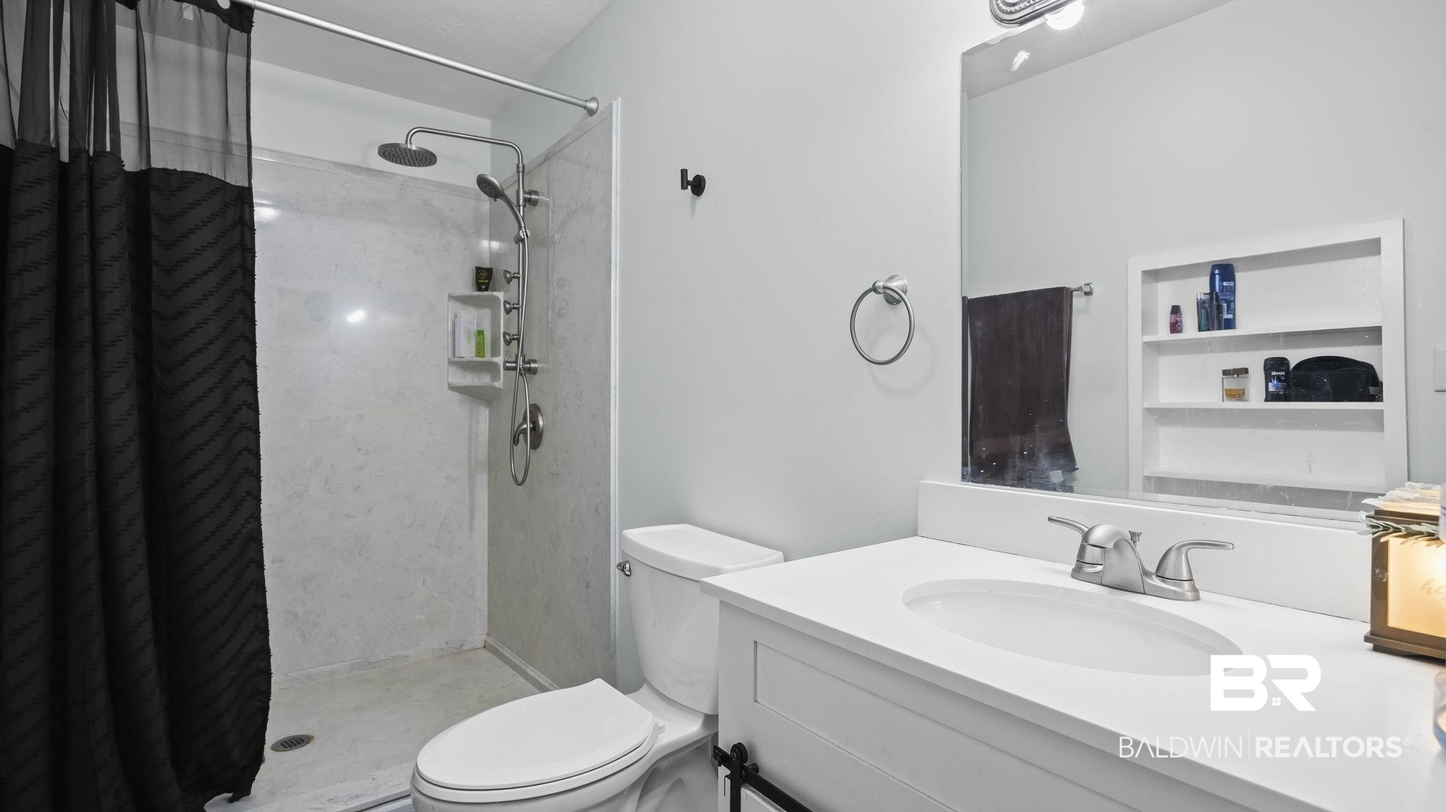 12855 Woodhaven Dairy Road West Silverhill, AL 36576 - Photo 22 of 27 Bathroom with a shower stall and vanity