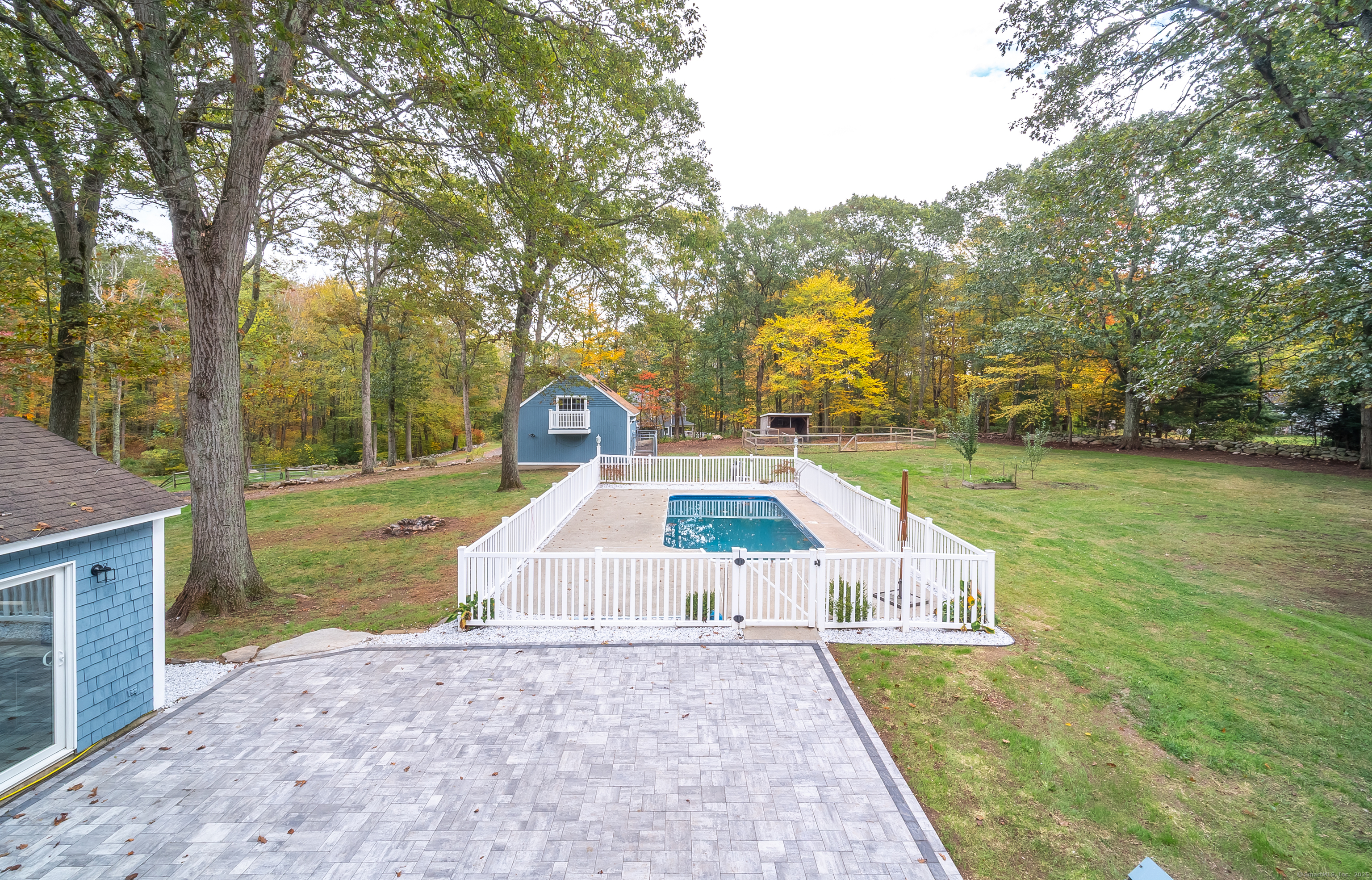 882 Killingworth Road Haddam, CT 06441 - Photo 11 of 40 a view of a swimming pool with a patio and a yard