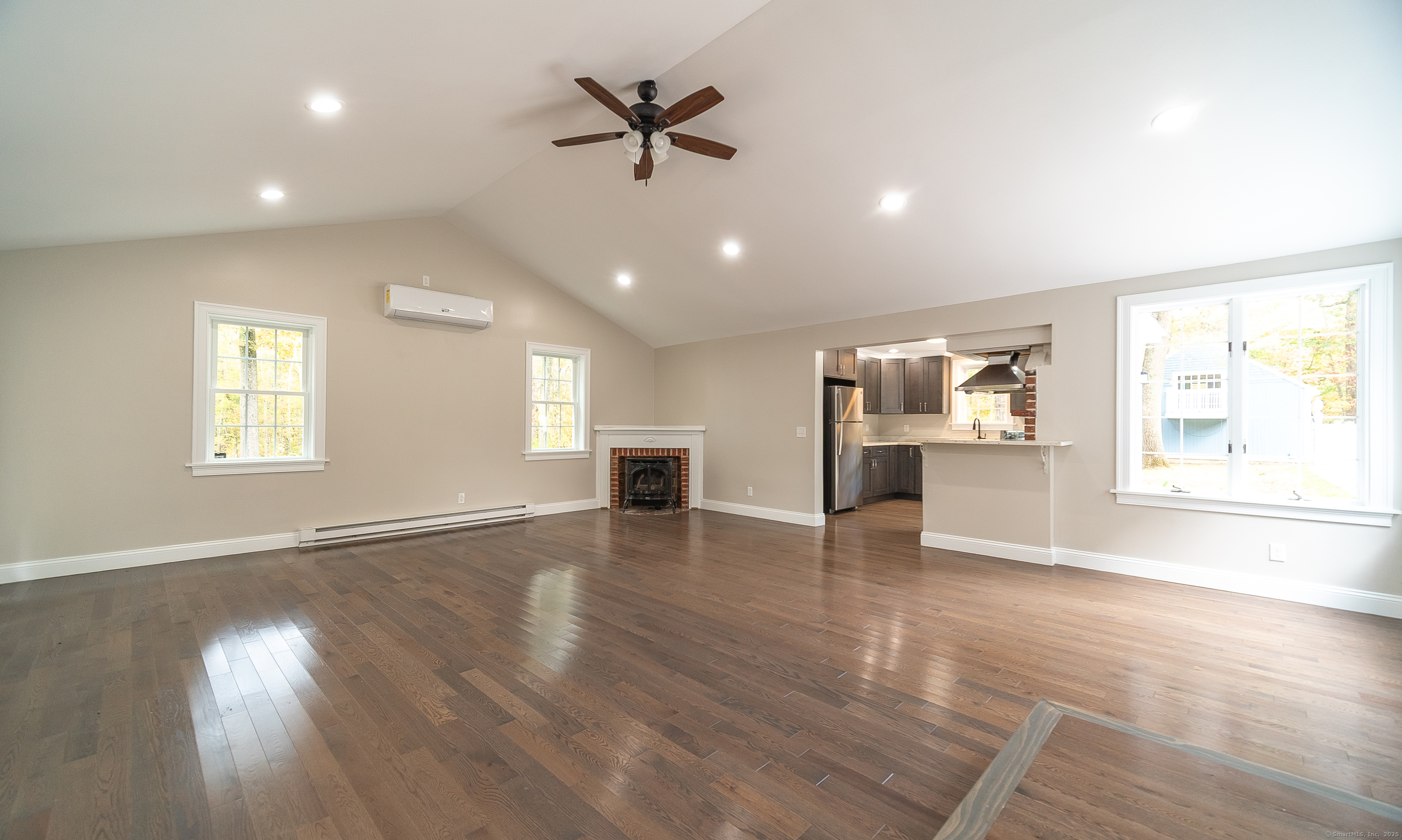 882 Killingworth Road Haddam, CT 06441 - Photo 16 of 40 a view of an empty room with a window and wooden floor