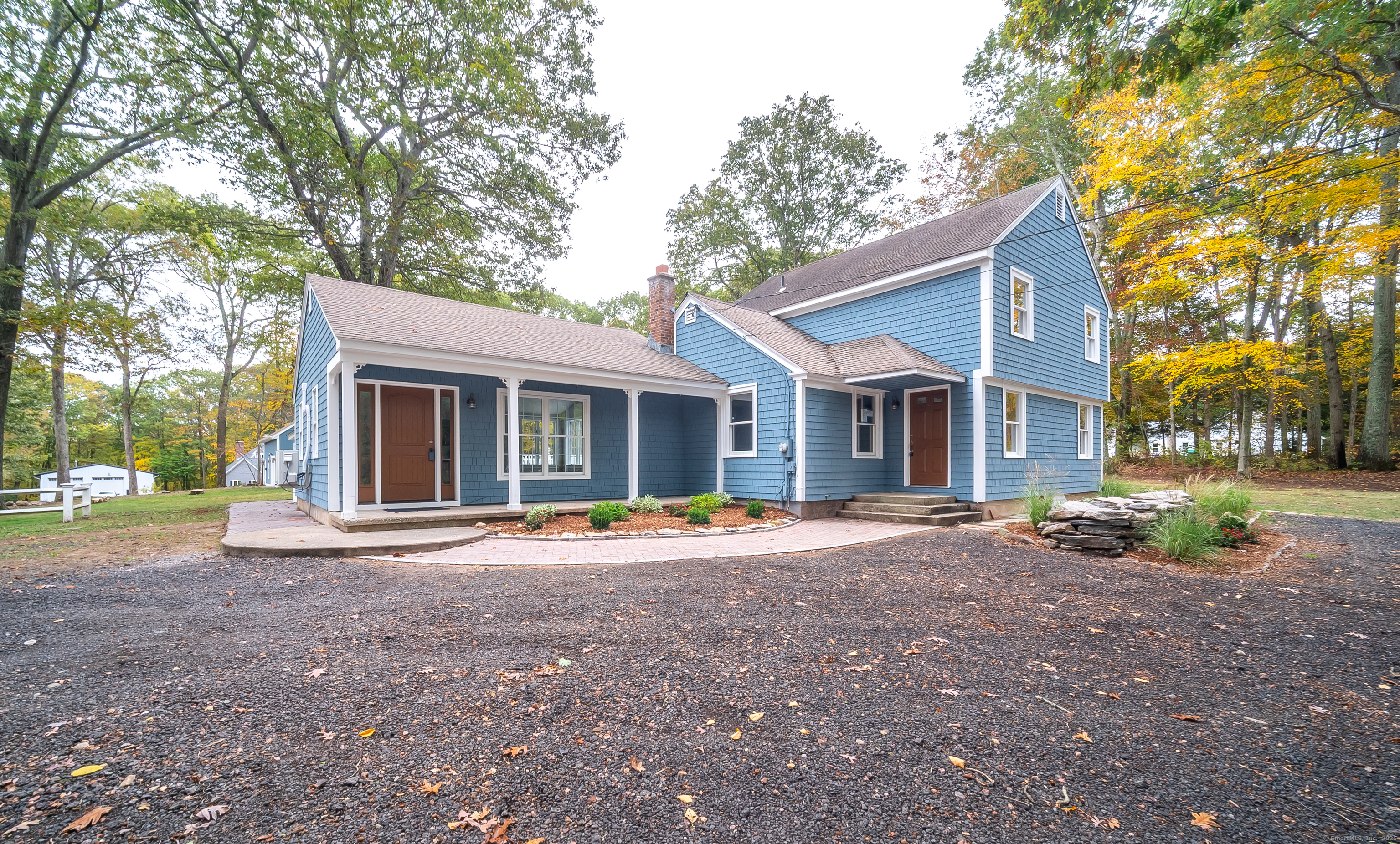 882 Killingworth Road Haddam, CT 06441 - Photo 2 of 40 a front view of a house with a yard and trees