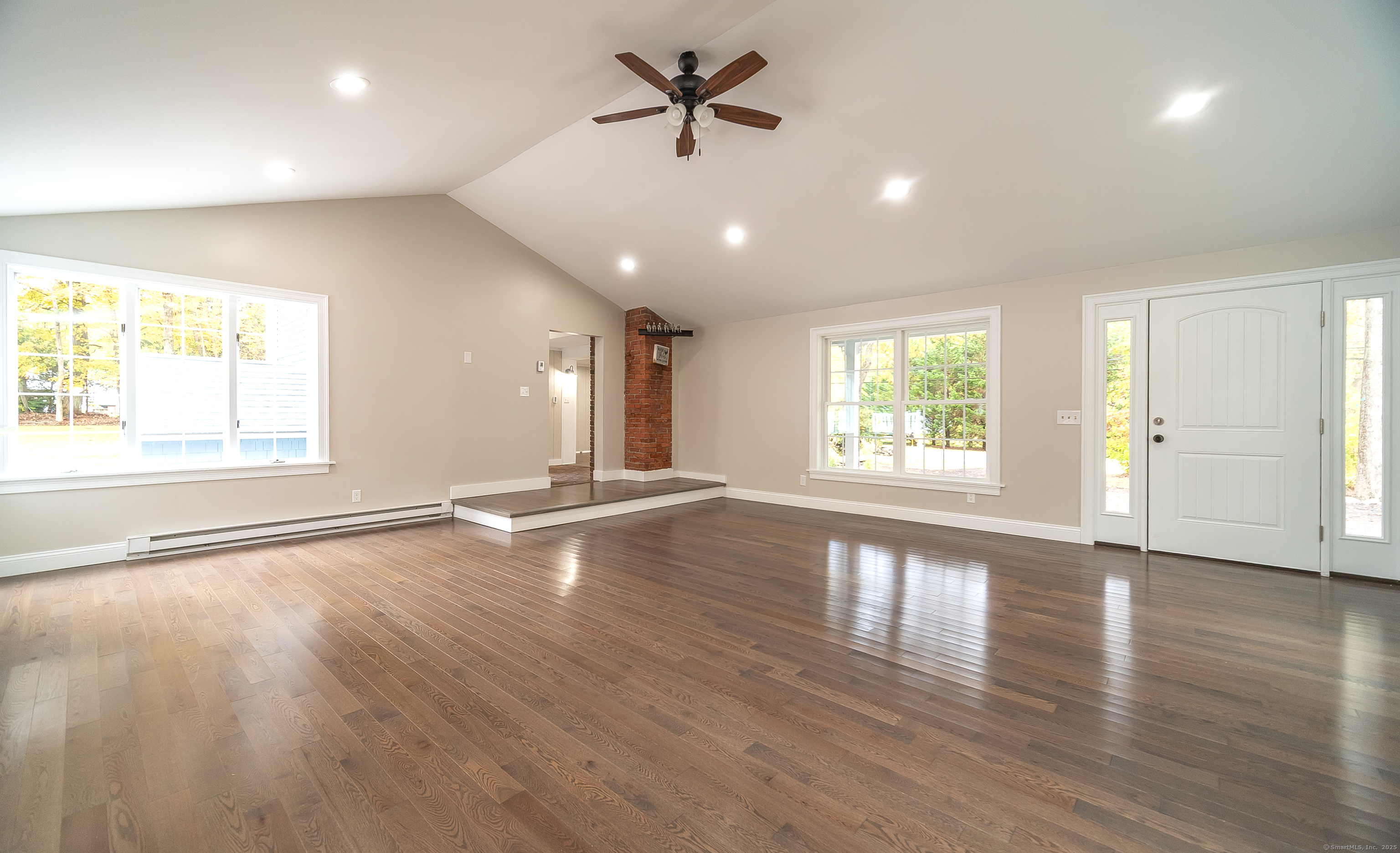 882 Killingworth Road Haddam, CT 06441 - Photo 21 of 40 a view of an empty room with a window and wooden floor