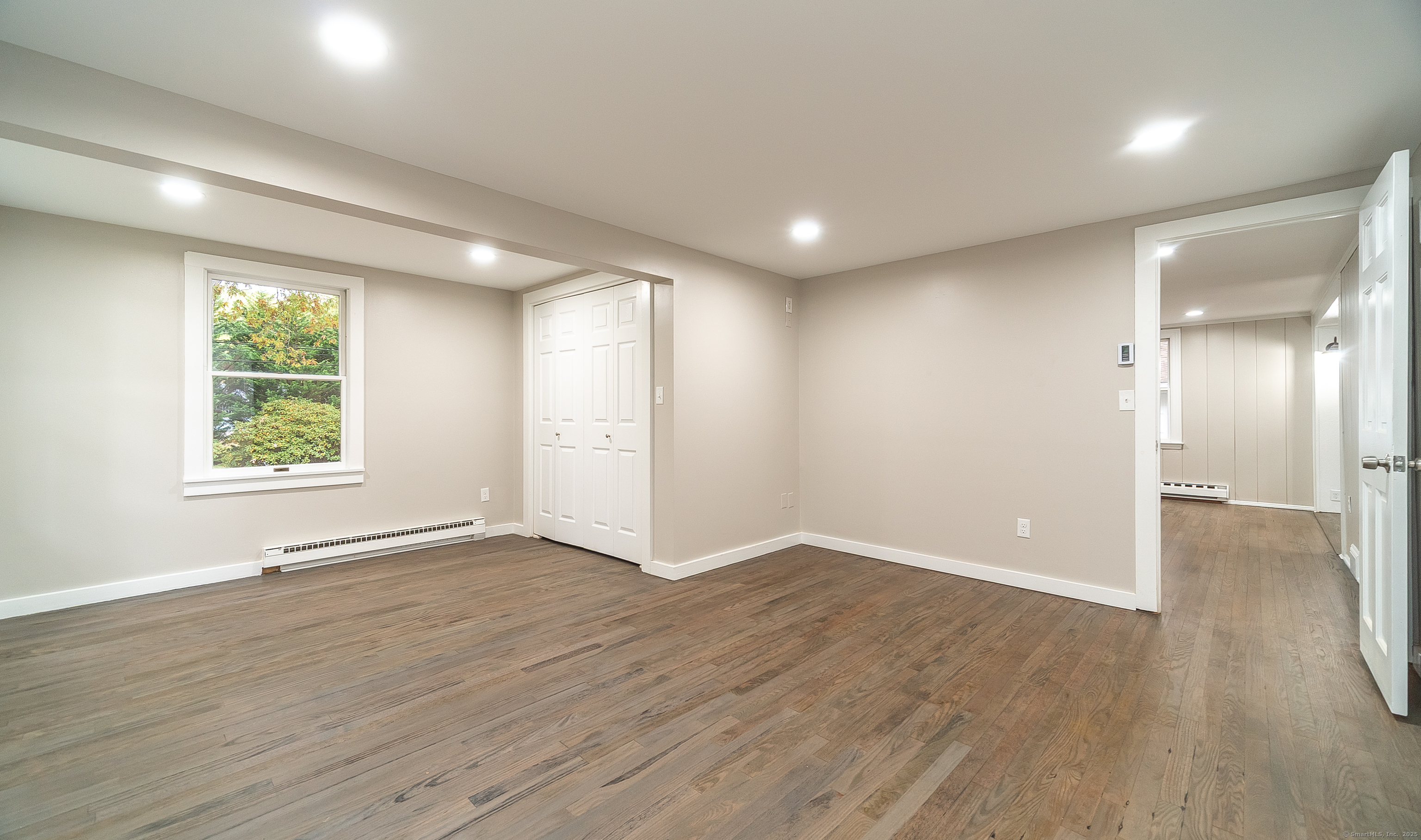 882 Killingworth Road Haddam, CT 06441 - Photo 27 of 40 an empty room with wooden floor and windows