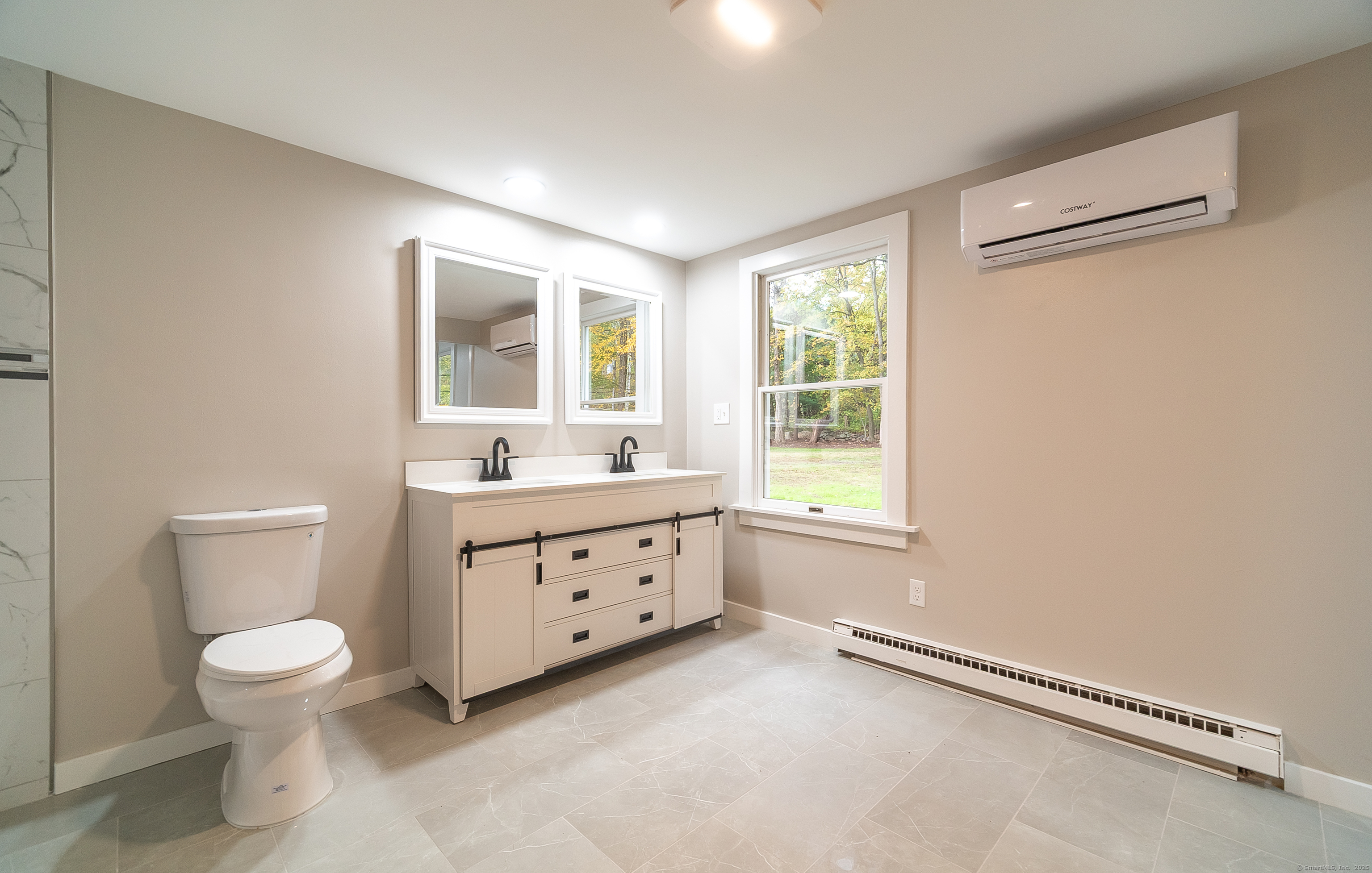 882 Killingworth Road Haddam, CT 06441 - Photo 31 of 40 a bathroom with a granite countertop toilet a sink and a window