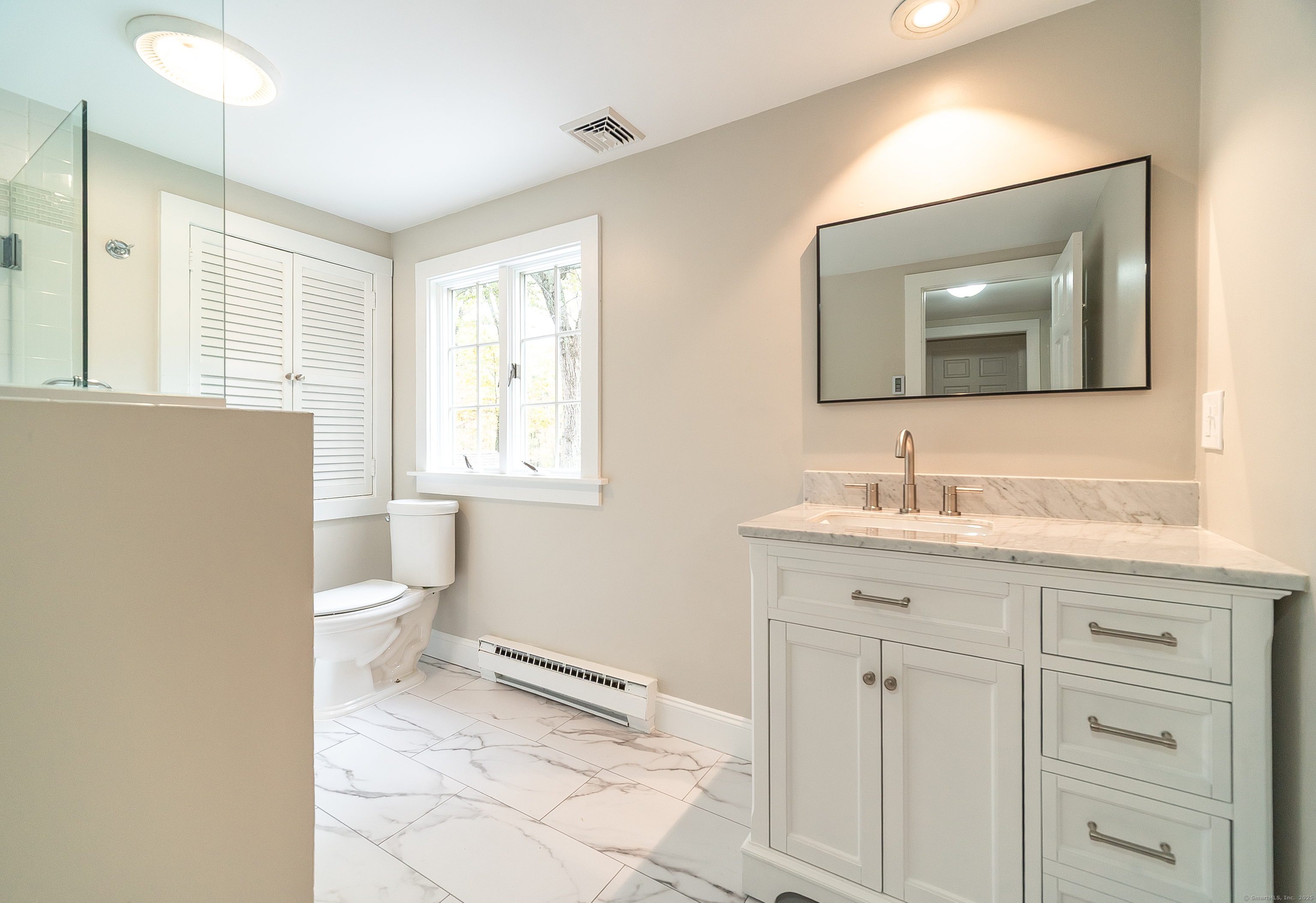 882 Killingworth Road Haddam, CT 06441 - Photo 35 of 40 a bathroom with a toilet sink and mirror
