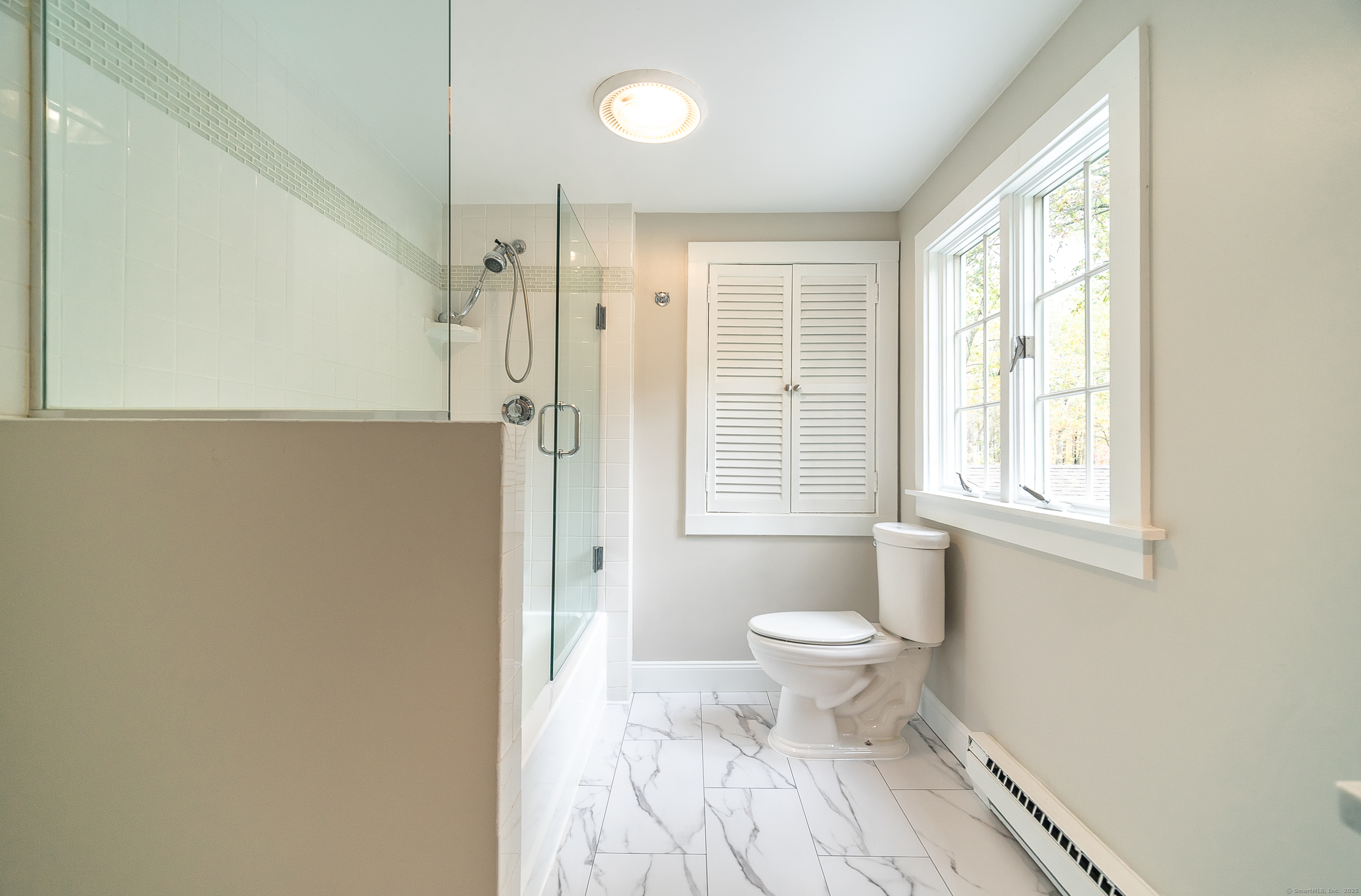 882 Killingworth Road Haddam, CT 06441 - Photo 36 of 40 a bathroom with a toilet sink a mirror and a shower