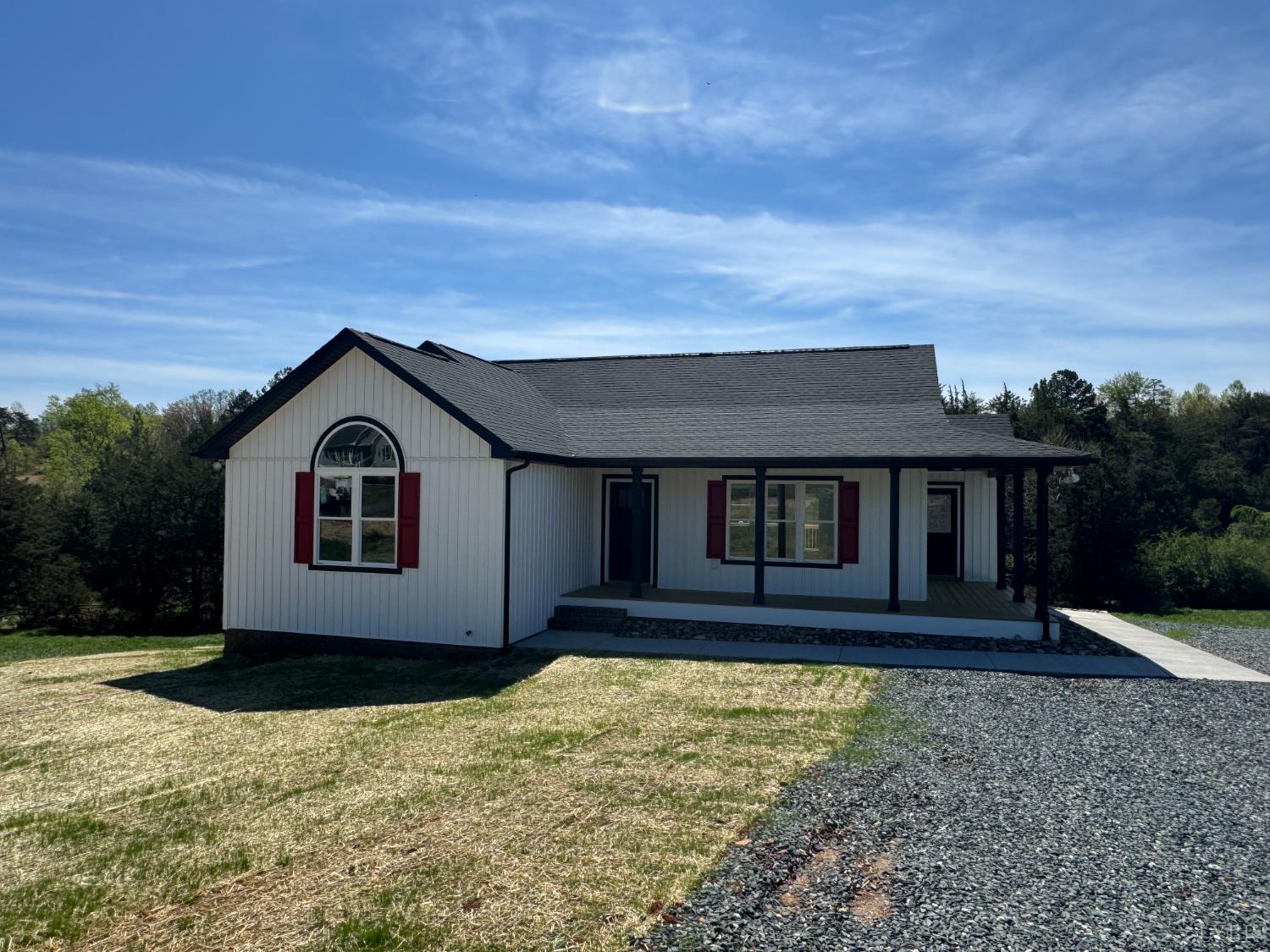 a view of house with yard and entertaining space