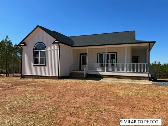 a front view of a house with a outdoor space