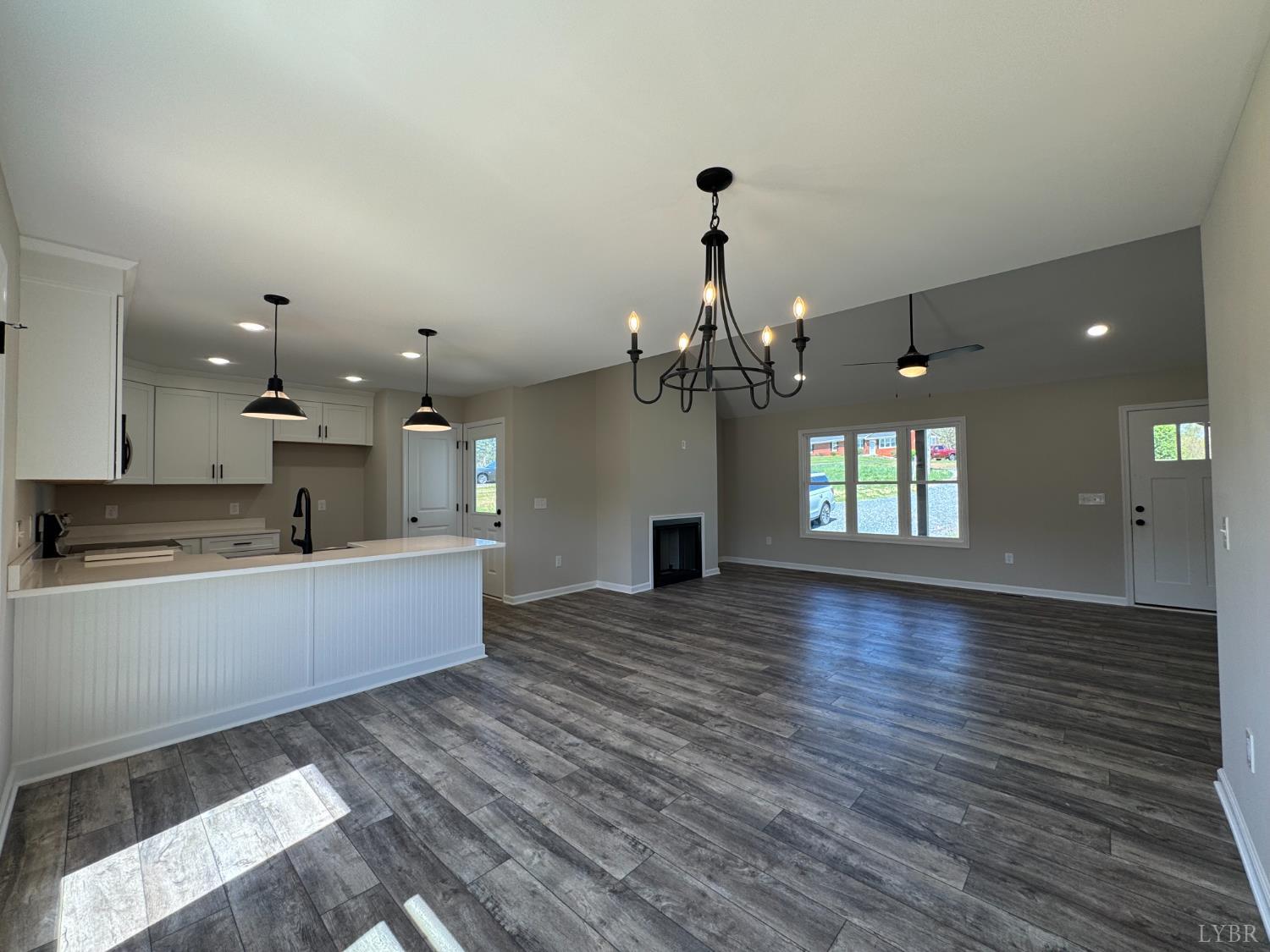 604 Stratford Road Concord, VA 24538 - Photo 5 of 28 a view of a room with wooden floor and kitchen