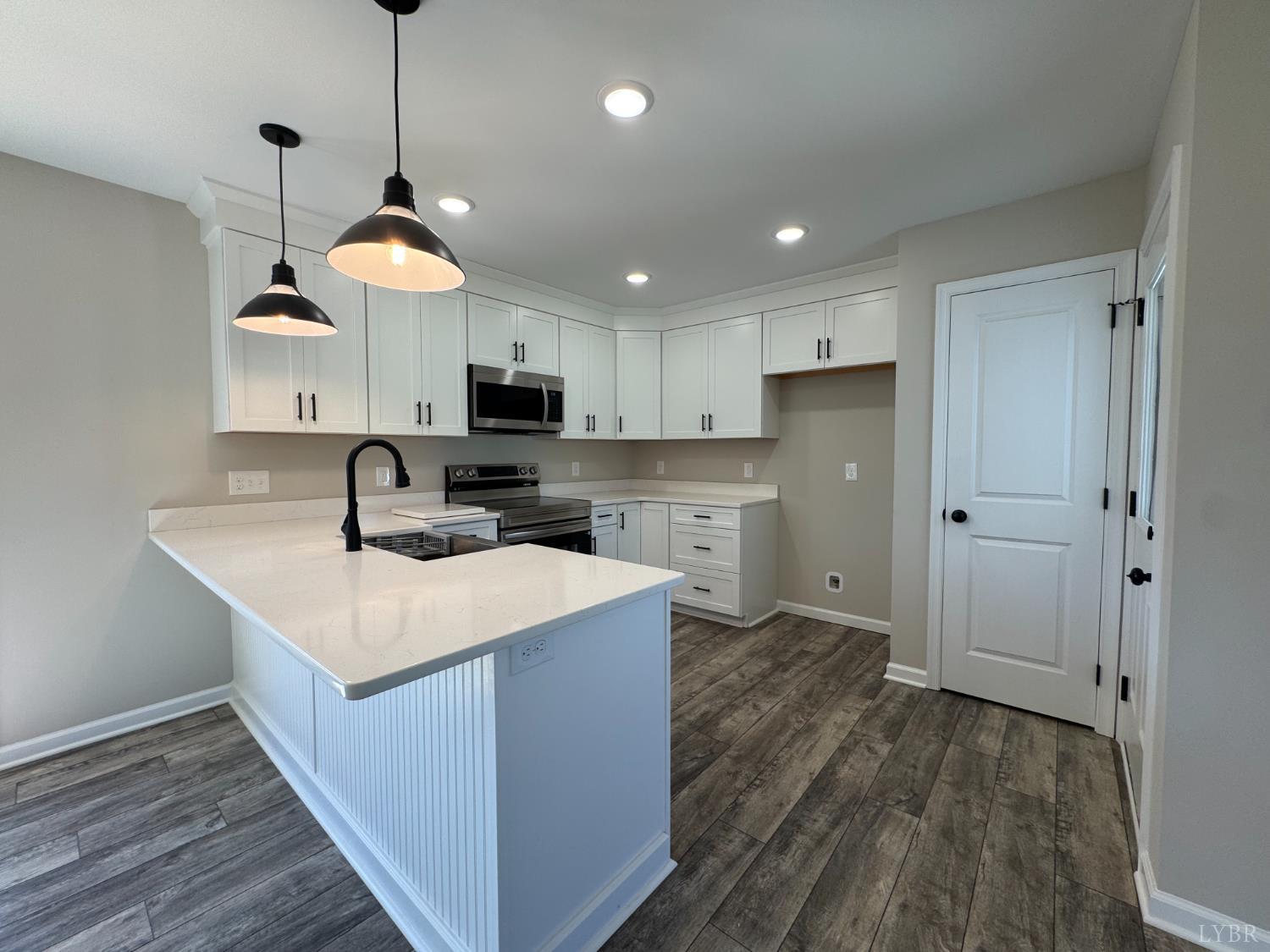 604 Stratford Road Concord, VA 24538 - Photo 6 of 28 a kitchen with kitchen island a sink stainless steel appliances and cabinets