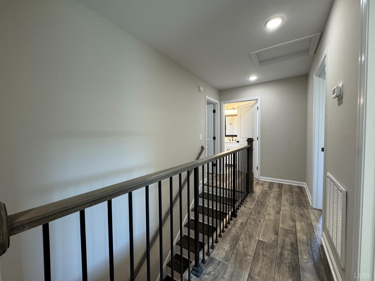 604 Stratford Road Concord, VA 24538 - Photo 8 of 28 a view of a hallway with wooden floor and staircase