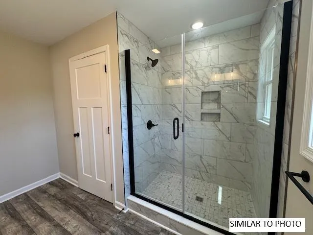 a bathroom with a sink toilet vanity and tub