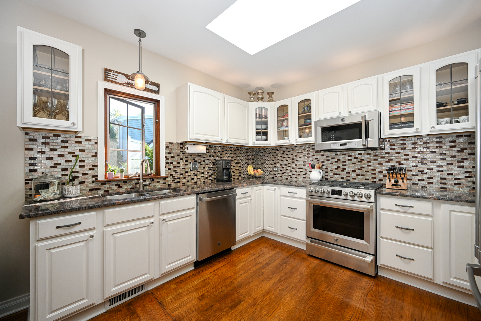 22W474 Emerson Avenue Glen Ellyn, IL 60137 - Photo 13 of 42 a kitchen with stainless steel appliances granite countertop a stove sink and cabinets