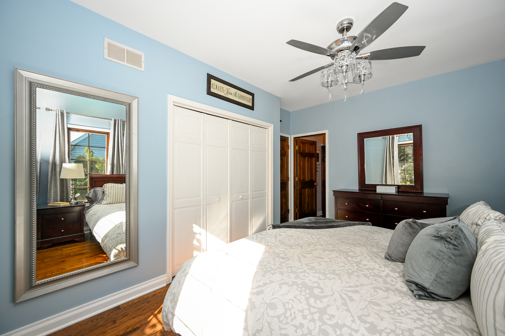 22W474 Emerson Avenue Glen Ellyn, IL 60137 - Photo 15 of 42 a bedroom with a bed and a chandelier