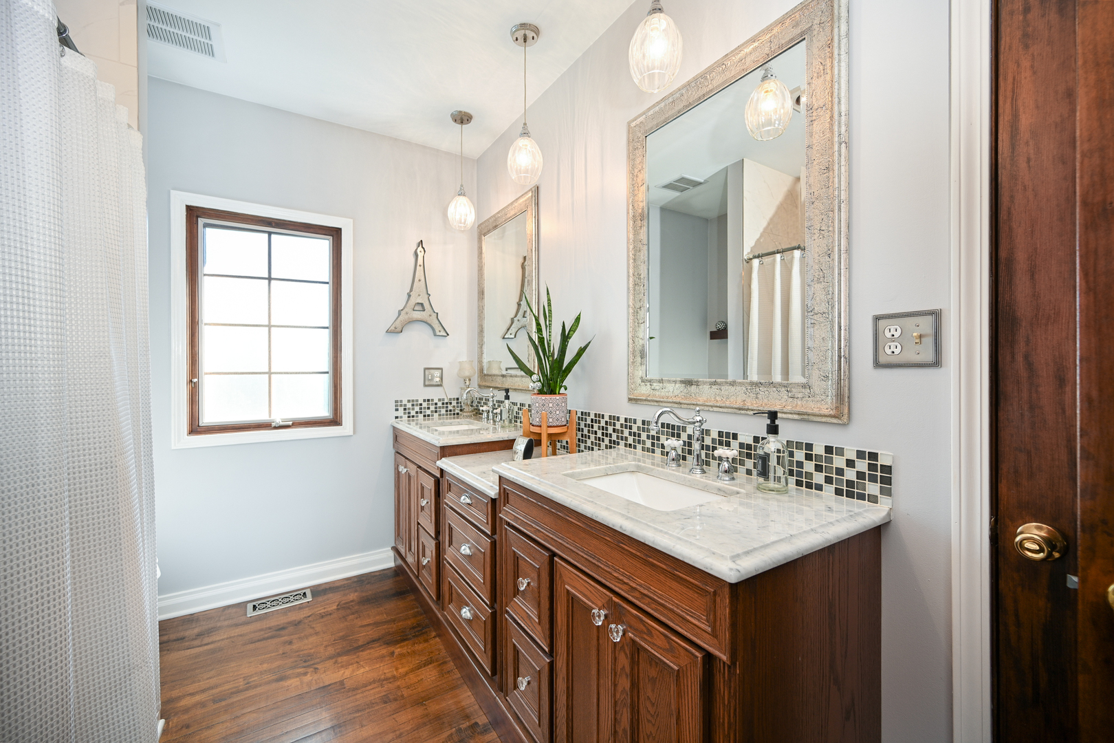 22W474 Emerson Avenue Glen Ellyn, IL 60137 - Photo 18 of 42 a bathroom with a sink and a mirror