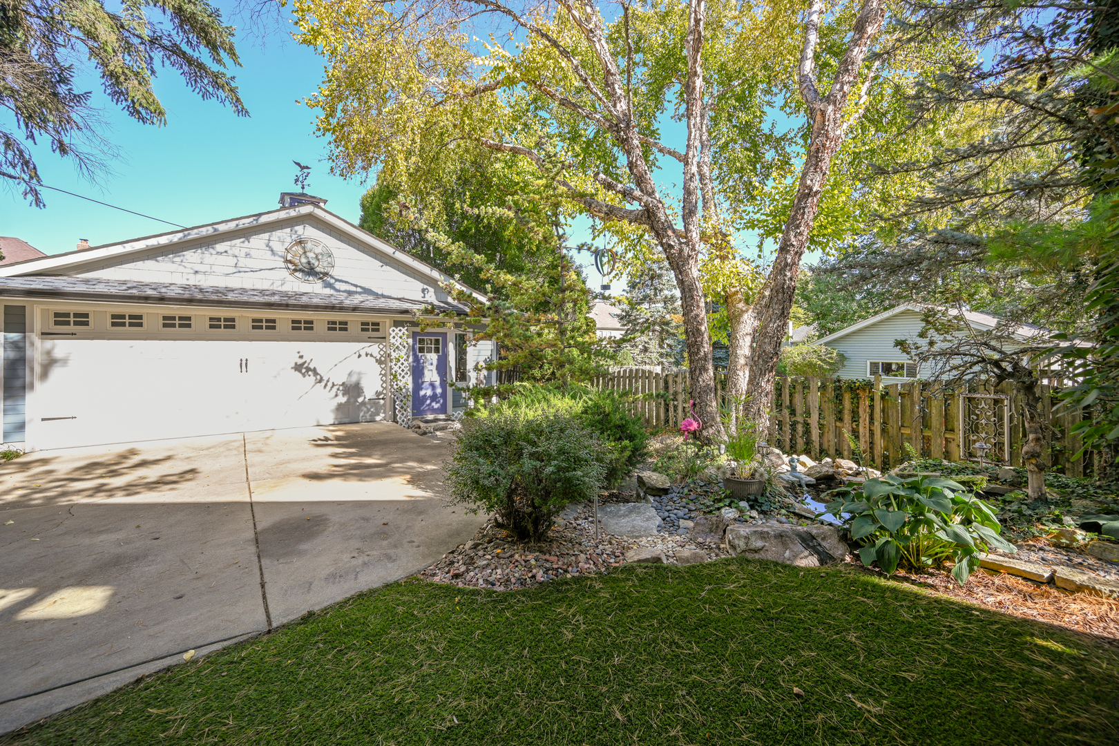 22W474 Emerson Avenue Glen Ellyn, IL 60137 - Photo 34 of 42 a view of a house with a small yard and plants