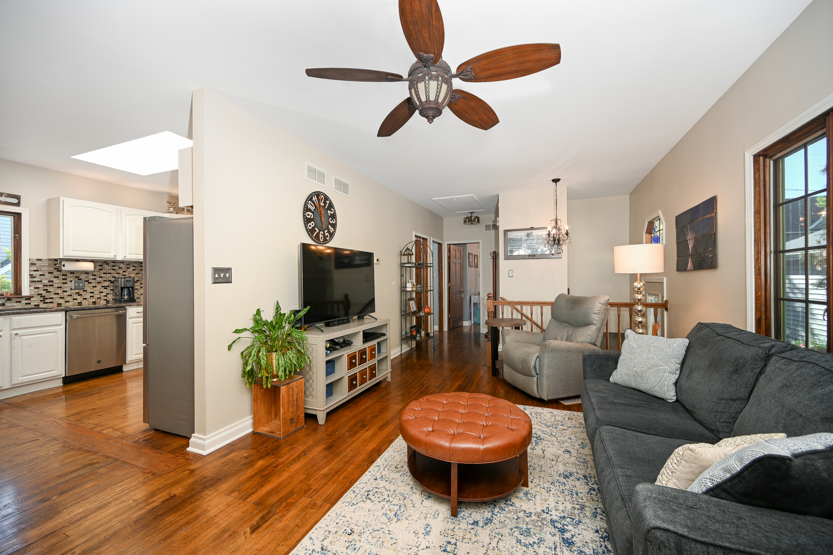 22W474 Emerson Avenue Glen Ellyn, IL 60137 - Photo 9 of 42 a living room with furniture and a flat screen tv