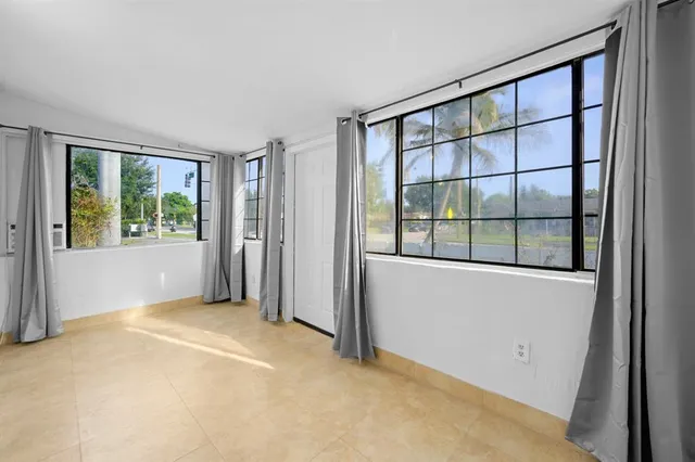 an empty room with windows