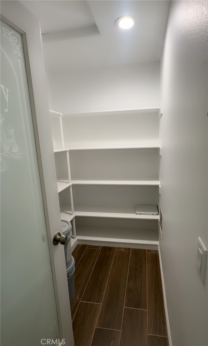 16506 Cactus Street Hesperia, CA 92345 - Photo 16 of 34 a view of walk in closet with empty racks