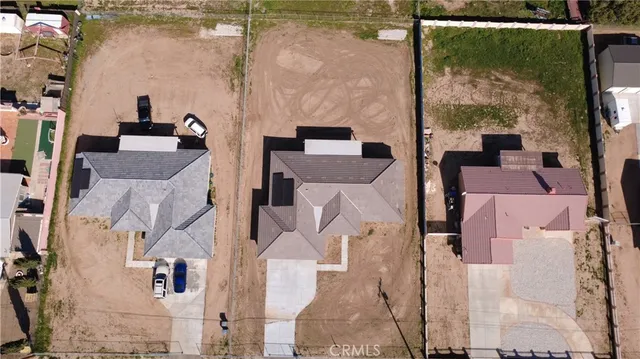 an aerial view of a residential apartment building with a yard