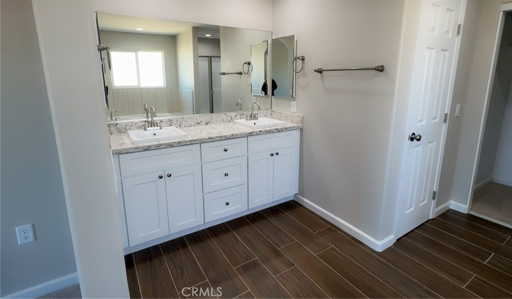 16506 Cactus Street Hesperia, CA 92345 - Photo 20 of 34 a bathroom with a granite countertop sink and a mirror