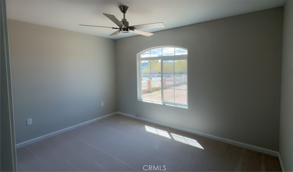 16506 Cactus Street Hesperia, CA 92345 - Photo 27 of 34 an empty room with windows and fan