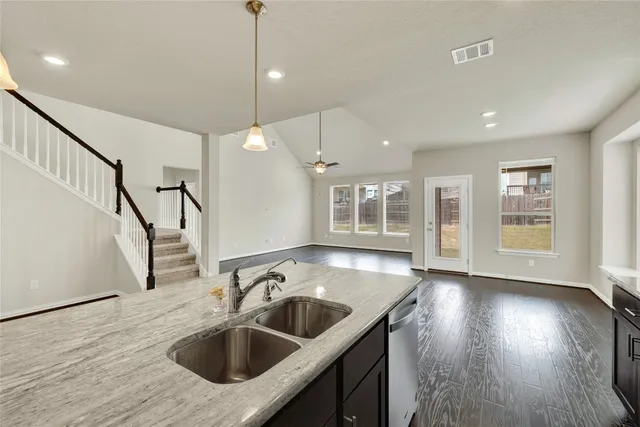 a kitchen with sink and window