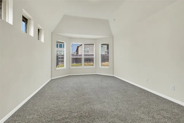 a bathroom with a bathtub shower sink double vanity and mirror