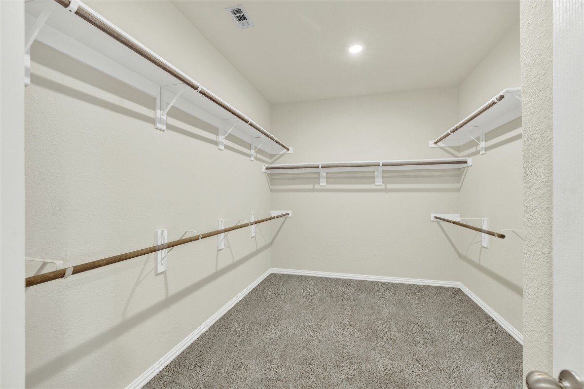 908 Leadtree Loop Buda, TX 78610 - Photo 24 of 38 a view of an empty walk in closet