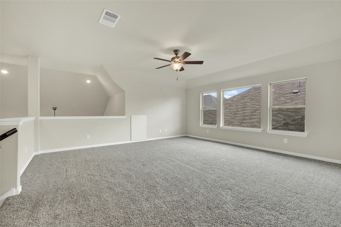908 Leadtree Loop Buda, TX 78610 - Photo 27 of 38 a view of a livingroom with a ceiling fan and window