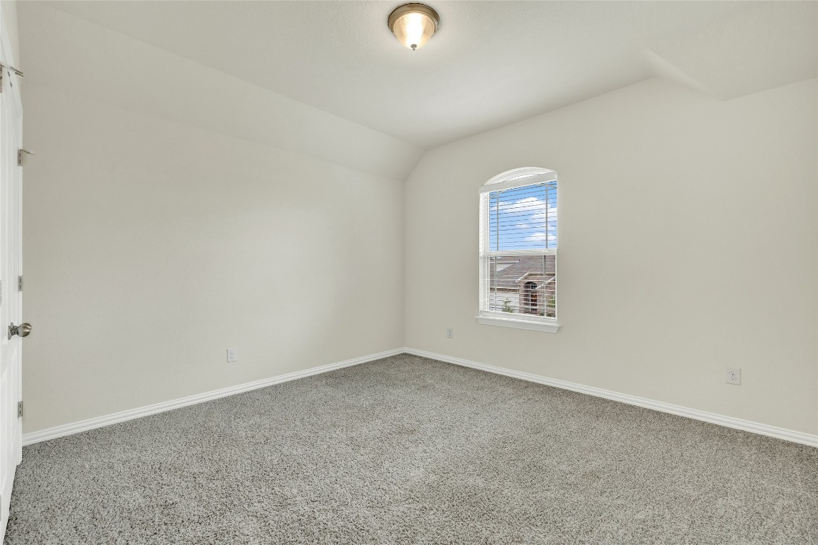 908 Leadtree Loop Buda, TX 78610 - Photo 30 of 38 an empty room with a window
