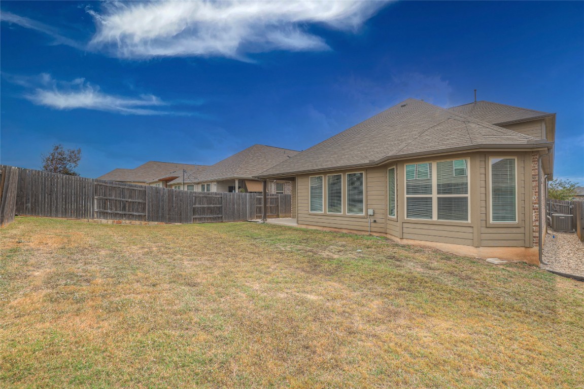 908 Leadtree Loop Buda, TX 78610 - Photo 37 of 38 a house view with a garden space