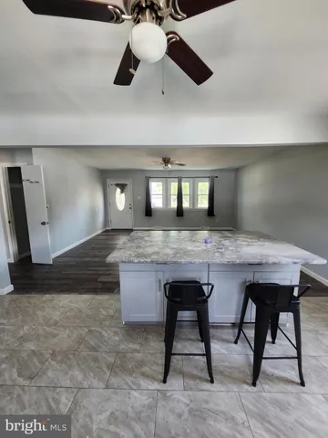 a kitchen with a table and chairs in it