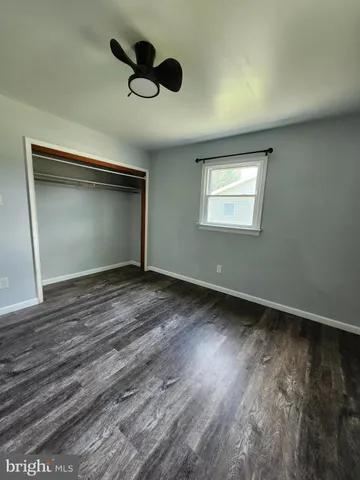 a view of a hallway view with wooden floor