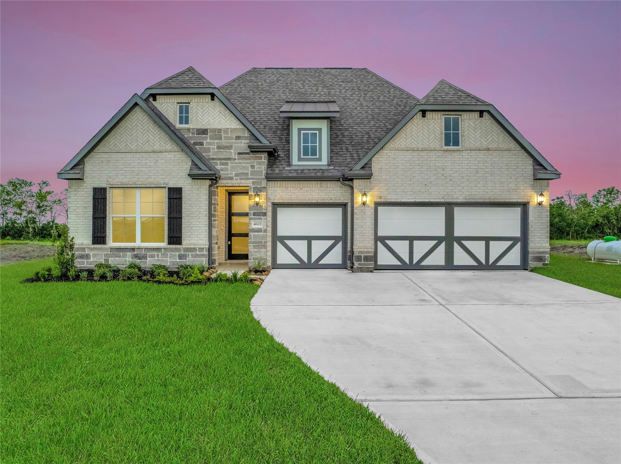 4602 Magnolia Bend Drive Rosharon, TX 77583 - Photo 1 of 39 a front view of a house with garden