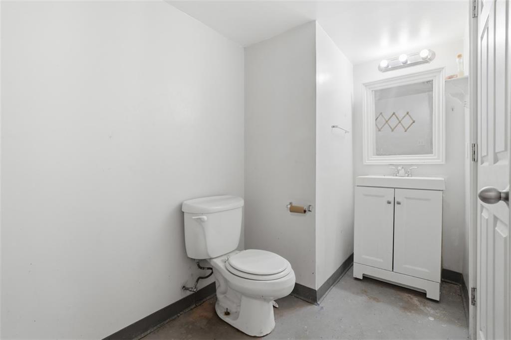 226 8th Street, Unit 224 Pittsburgh, PA 15215 - Photo 30 of 42 a white toilet sitting next to a bathroom sink