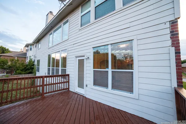 a view of a house with wooden deck