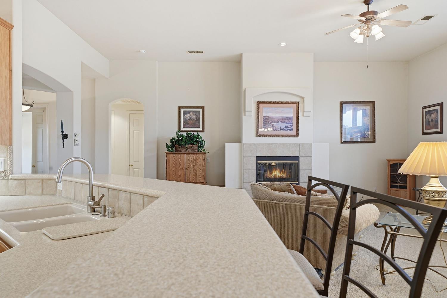 719 Shakeley Lane Ione, CA 95640 - Photo 14 of 68 a view of a livingroom with furniture and a kitchen