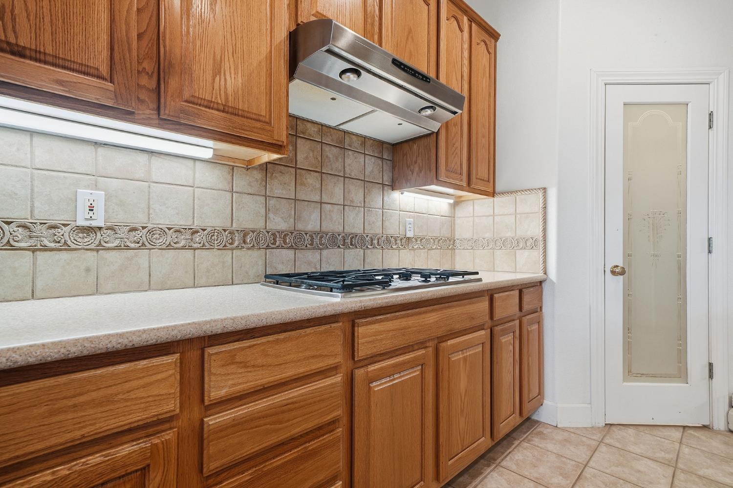 719 Shakeley Lane Ione, CA 95640 - Photo 16 of 68 a kitchen with granite countertop cabinets and white appliances