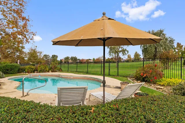 a view of front of house with a yard and garage