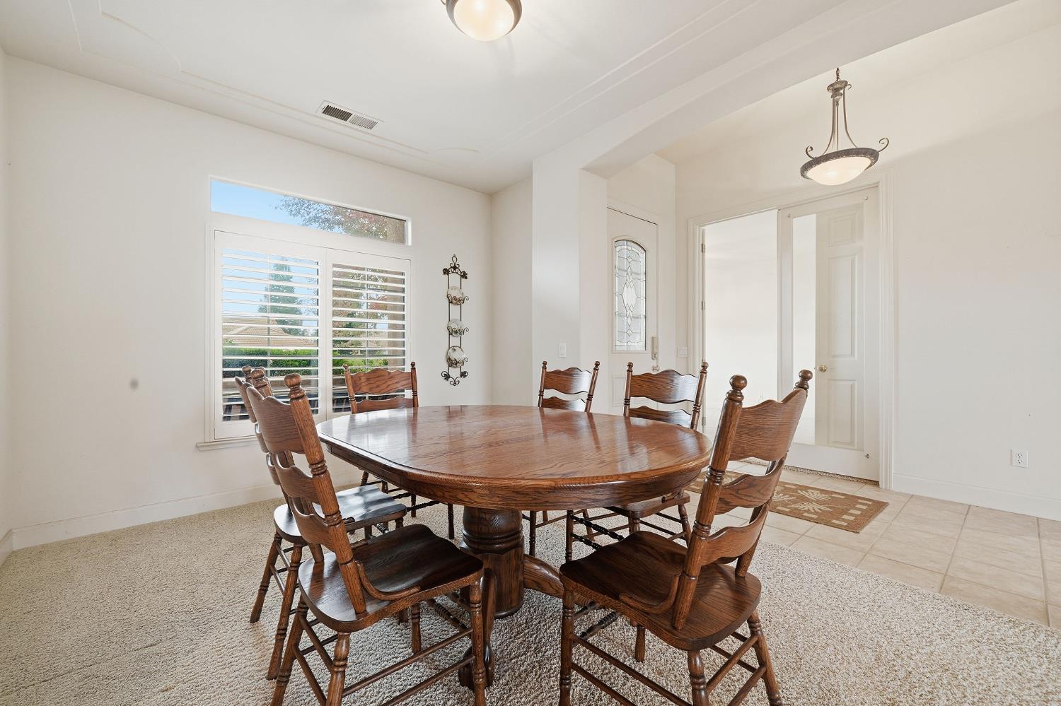 719 Shakeley Lane Ione, CA 95640 - Photo 25 of 68 a view of a dining room with furniture window and outside view