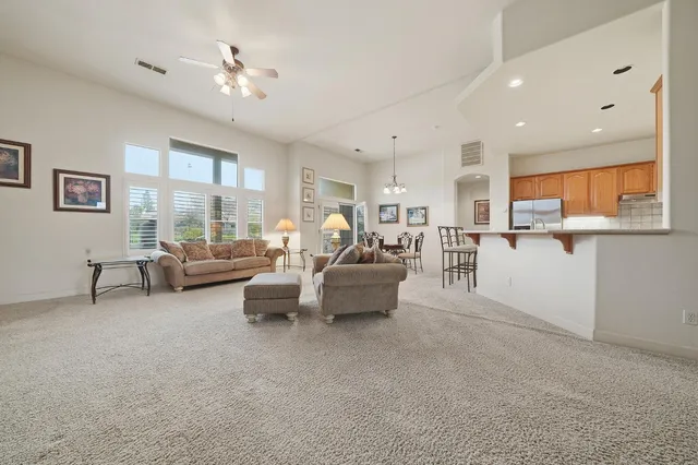 a spacious bedroom with a bed and a window