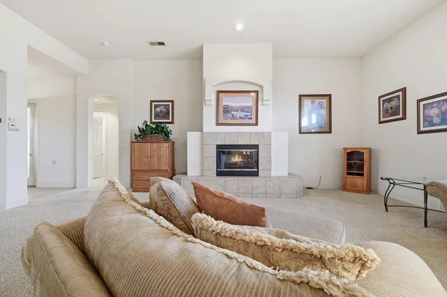 a spacious bathroom with a granite countertop sink a mirror and a