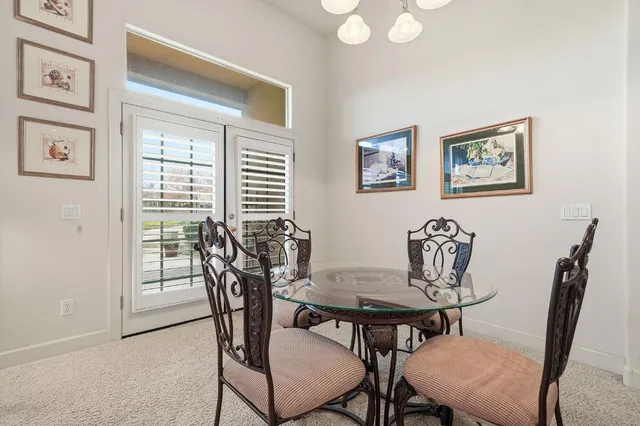 a bathroom with a double vanity sink a mirror and a bathtub