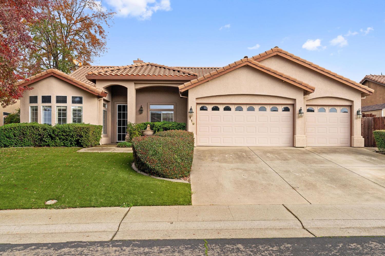 719 Shakeley Lane Ione, CA 95640 - Photo 4 of 68 a view of front of house with a yard and garage