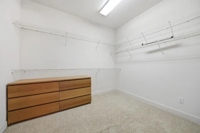 a front view of a house with patio furniture and fire pit