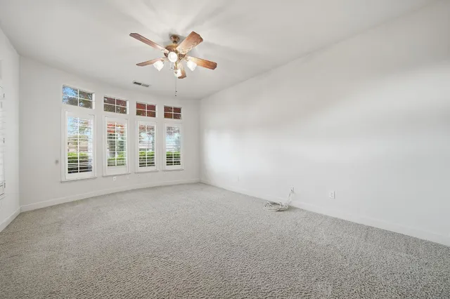 an aerial view of a house with swimming pool and outdoor space