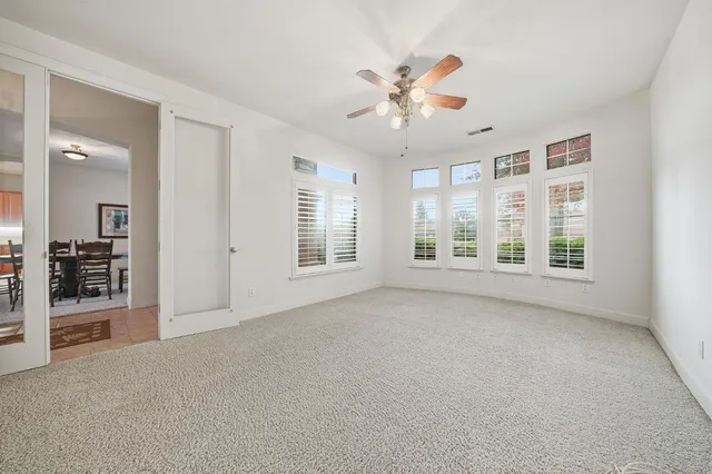 an aerial view of a house with a garden and lake view